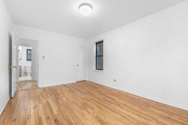 unfurnished room with light hardwood / wood-style flooring