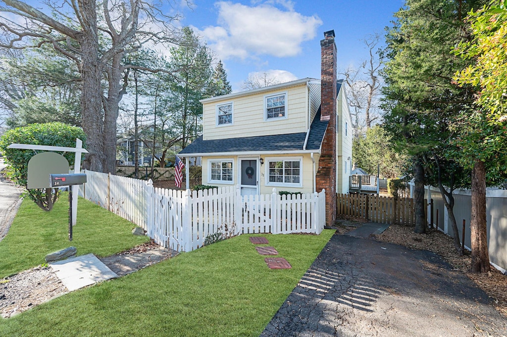 front facade with a front yard