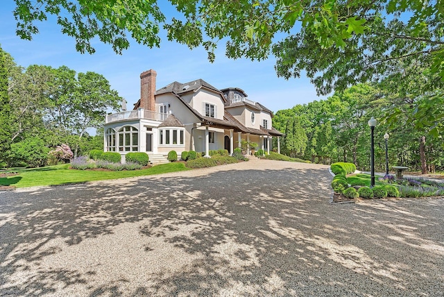 view of front of home with a balcony