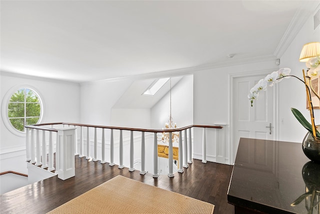 corridor with dark hardwood / wood-style flooring, crown molding, and a skylight