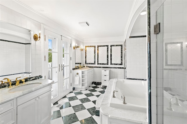 bathroom with separate shower and tub, crown molding, vanity, and tile walls