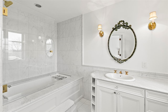 bathroom featuring vanity and tile walls