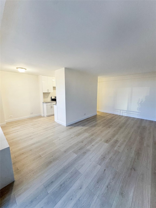 unfurnished living room with light hardwood / wood-style floors