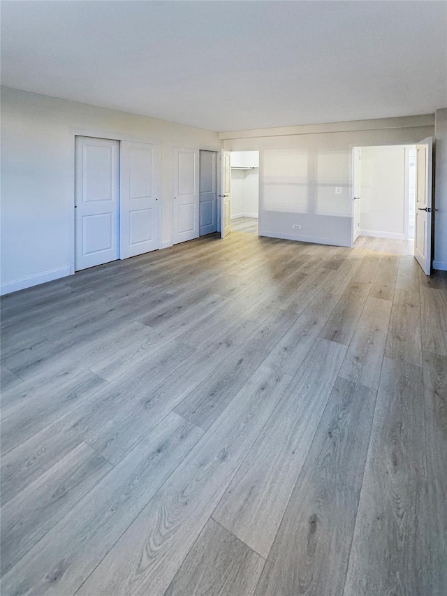 unfurnished living room featuring light hardwood / wood-style floors