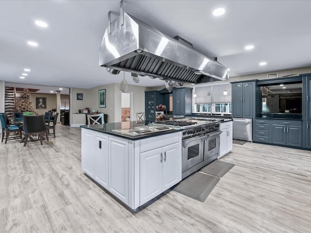 kitchen with a center island, white cabinets, light hardwood / wood-style floors, island exhaust hood, and stainless steel appliances