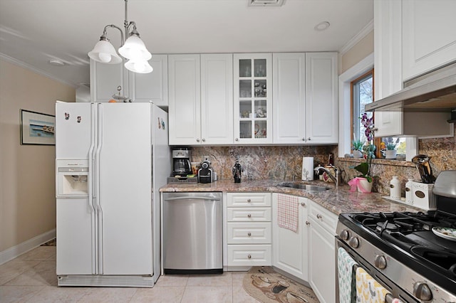 kitchen with decorative light fixtures, light stone countertops, white cabinetry, and appliances with stainless steel finishes