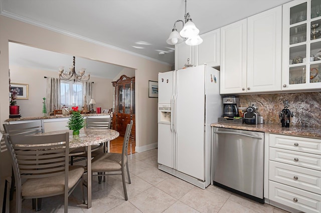 kitchen featuring dishwasher, white refrigerator with ice dispenser, pendant lighting, a chandelier, and white cabinets