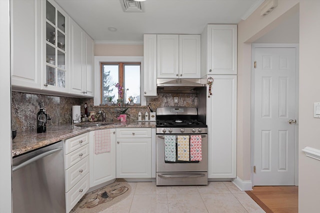 kitchen with appliances with stainless steel finishes, white cabinetry, and sink