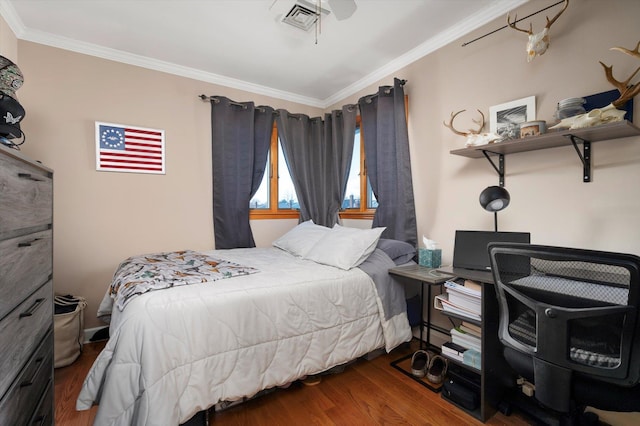 bedroom featuring dark hardwood / wood-style flooring, a baseboard radiator, ceiling fan, and crown molding