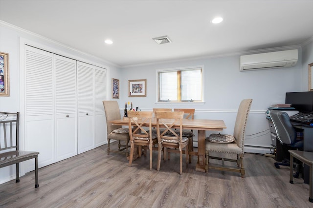 dining room featuring crown molding, wood-type flooring, a wall mounted air conditioner, and a baseboard heating unit