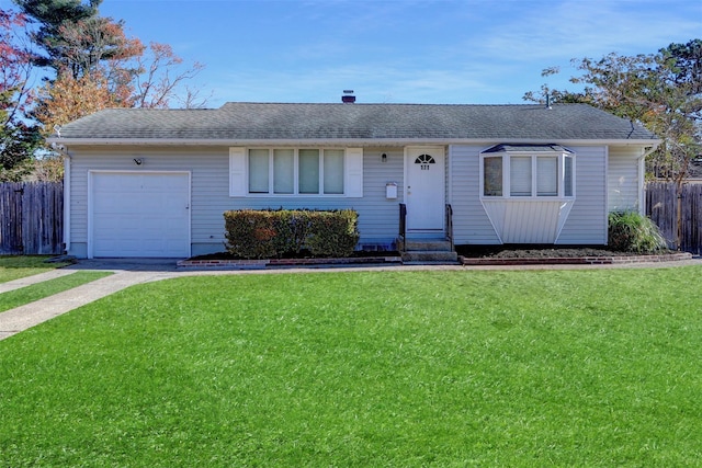 ranch-style home with a garage and a front yard