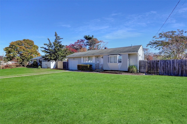 ranch-style house with a front yard and a garage