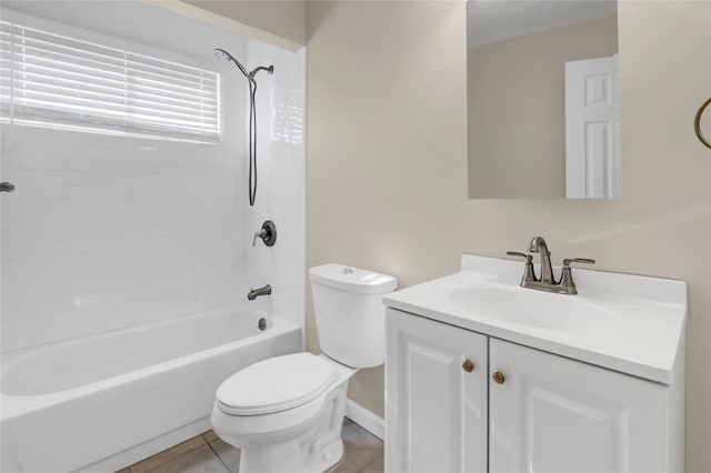 full bathroom with tile patterned floors, tiled shower / bath, vanity, and toilet