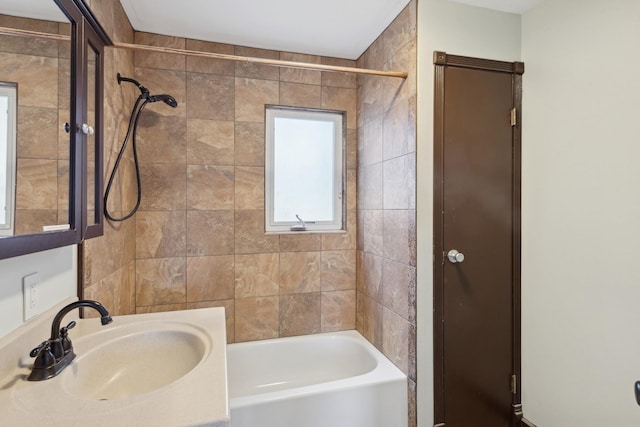 bathroom with sink and tiled shower / bath combo