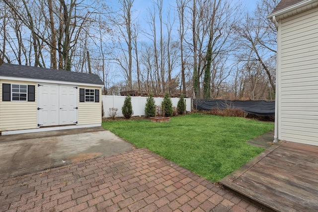 view of yard featuring a storage shed and a patio