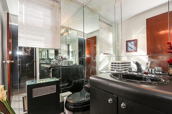 bathroom featuring tile patterned flooring, vanity, and toilet