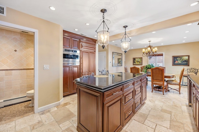 kitchen featuring a kitchen island, a baseboard heating unit, decorative light fixtures, an inviting chandelier, and oven