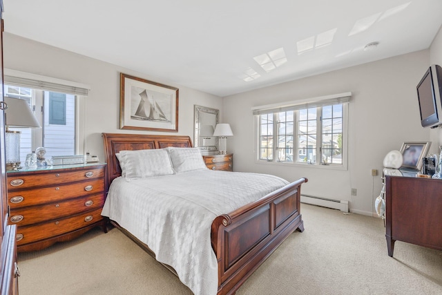 carpeted bedroom featuring baseboard heating