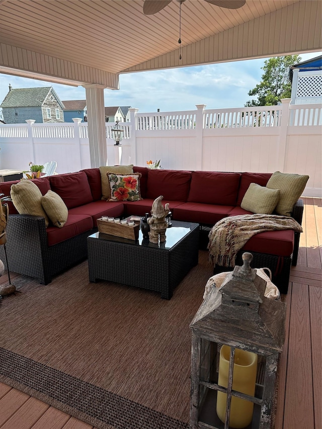 wooden terrace featuring an outdoor hangout area and ceiling fan