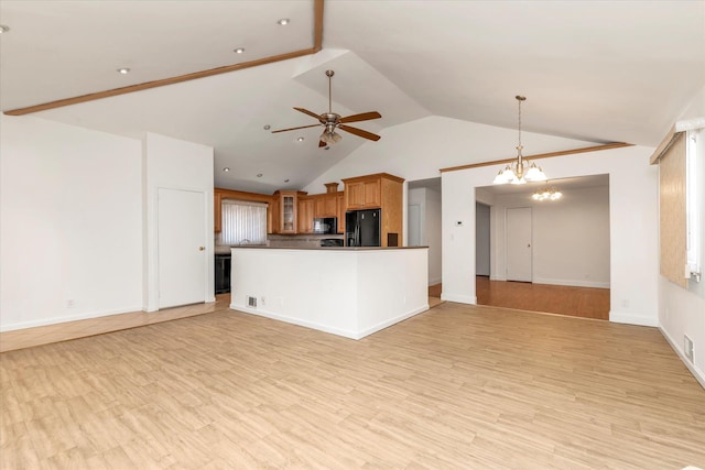 20070 39th Ave, Bayside, NY 11361 - unfurnished living room featuring ceiling fan, vaulted ceiling, a chandelier, light wood-style floors, and baseboards
