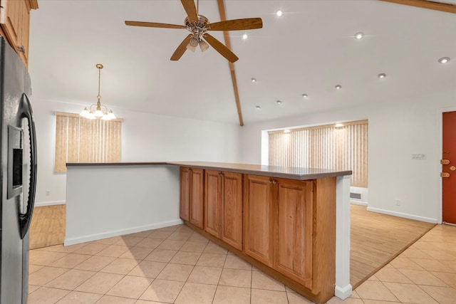 20070 39th Ave, Bayside, NY 11361 - kitchen featuring black refrigerator with ice dispenser, lofted ceiling, ceiling fan, light tile patterned floors, and baseboards