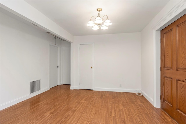 20070 39th Ave, Bayside, NY 11361 - unfurnished bedroom with a chandelier, light wood-style flooring, baseboards, and a closet