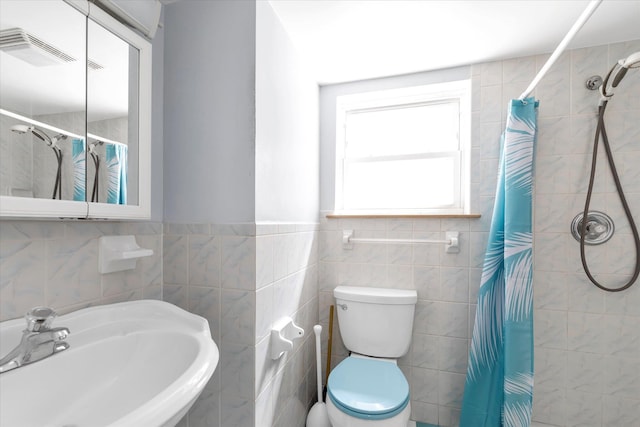 20070 39th Ave, Bayside, NY 11361 - bathroom with a sink, tile walls, toilet, and a tile shower