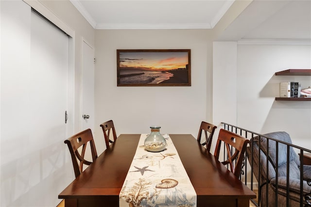 dining room featuring crown molding