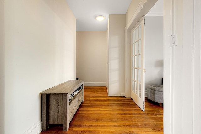 hall with light hardwood / wood-style flooring