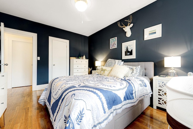 bedroom with hardwood / wood-style floors