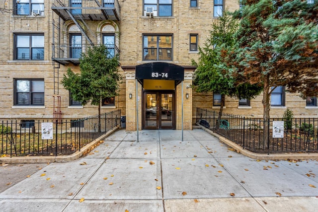 view of exterior entry featuring french doors