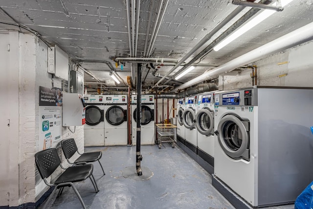 clothes washing area featuring washer and clothes dryer