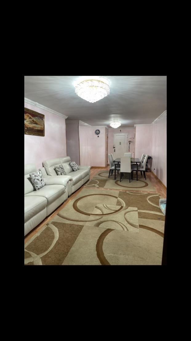 living room featuring crown molding