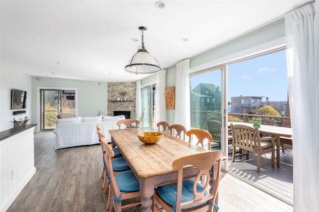 362 Ocean Walk, Fire Island Pines, NY 11782 - dining space featuring a fireplace, wood finished floors, and recessed lighting