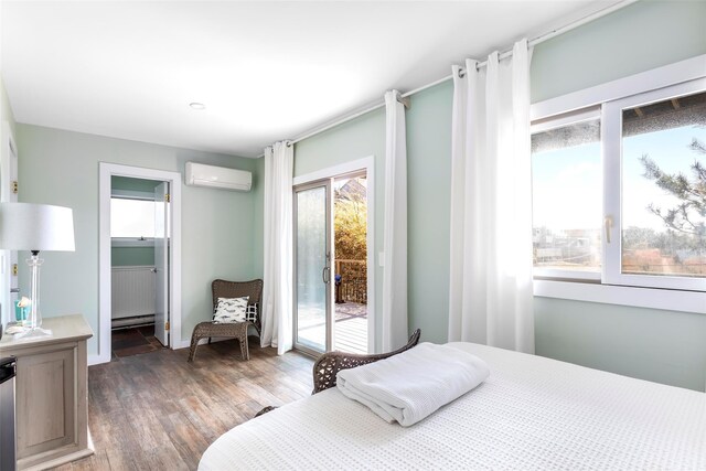 362 Ocean Walk, Fire Island Pines, NY 11782 - bedroom with a wall mounted AC, access to outside, and wood finished floors