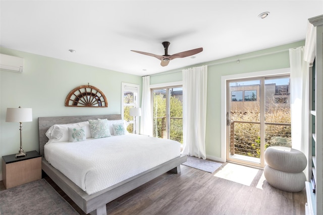 362 Ocean Walk, Fire Island Pines, NY 11782 - bedroom with access to outside, an AC wall unit, multiple windows, wood finished floors, and recessed lighting