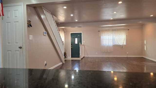 foyer entrance with dark wood-type flooring