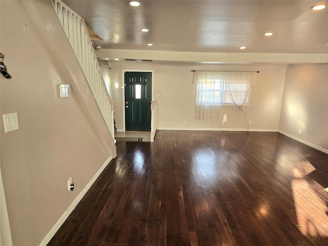 foyer with dark hardwood / wood-style floors