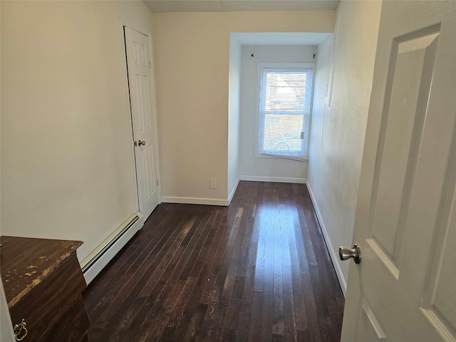 interior space featuring dark hardwood / wood-style flooring and baseboard heating