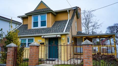 110-17 Monterey St, Queens Village, NY 11429 - view of front of home featuring a fenced front yard and roof with shingles