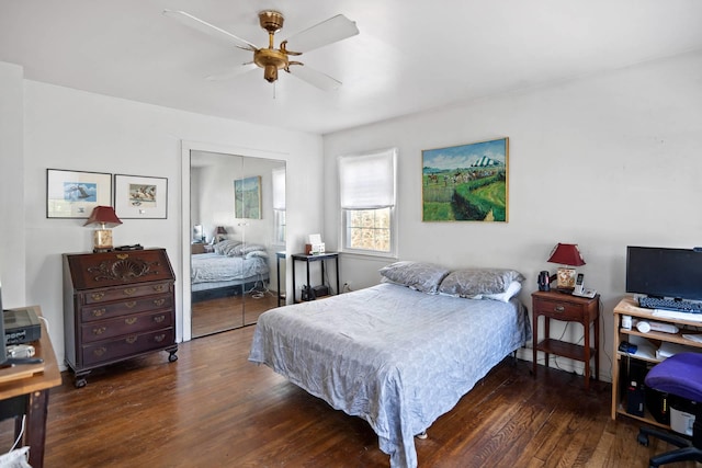 bedroom featuring ceiling fan, a closet, and dark hardwood / wood-style floors