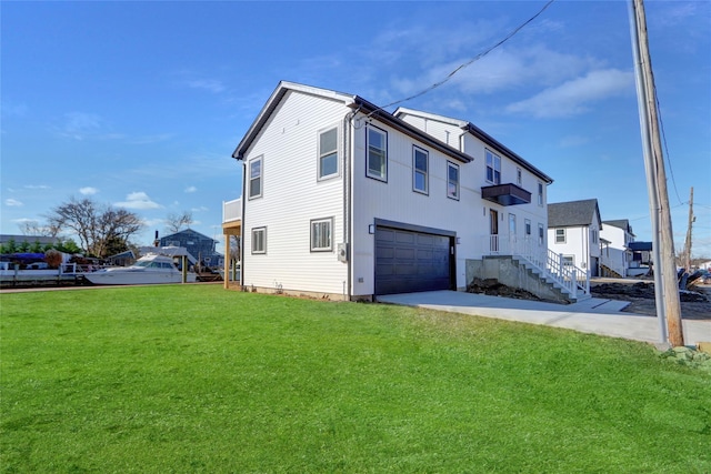 view of home's exterior with a garage and a yard