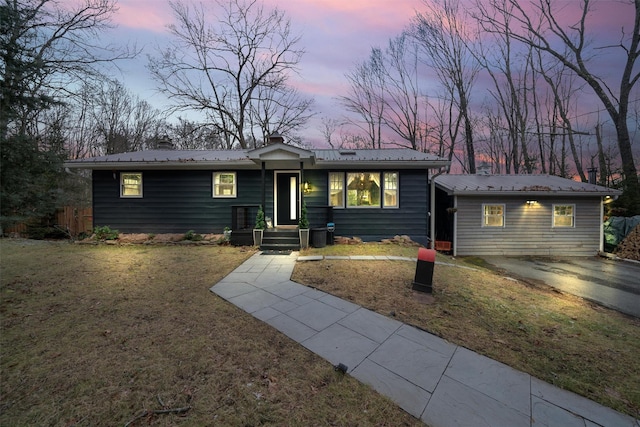 ranch-style house featuring a lawn