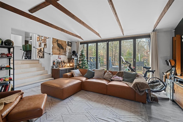 living room featuring lofted ceiling with beams and light hardwood / wood-style flooring