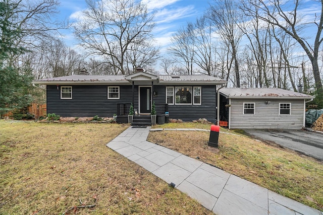 ranch-style home with a front lawn