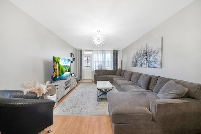 living room with a chandelier and hardwood / wood-style floors