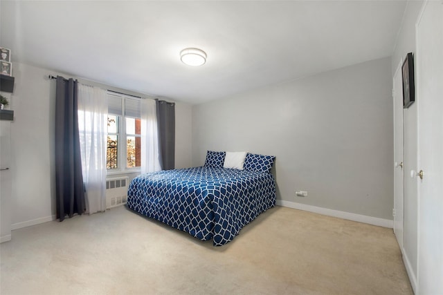 bedroom with carpet and radiator heating unit