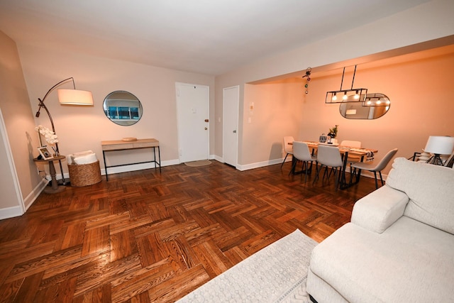 living room featuring dark parquet flooring