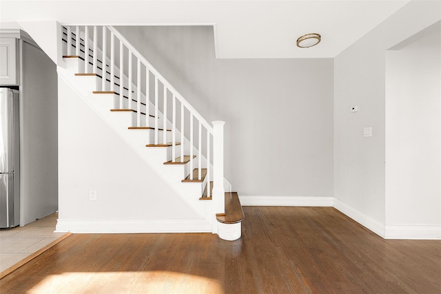 stairway featuring hardwood / wood-style flooring