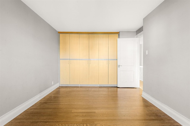 unfurnished room with light hardwood / wood-style floors